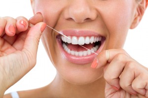 How To Floss Properly For The Prettiest Pearly Whites