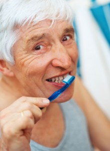 A Senior Woman Brushing her Teeth
