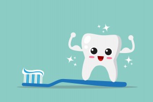 Cute, strong and happy tooth with toothbrush and toothpaste.